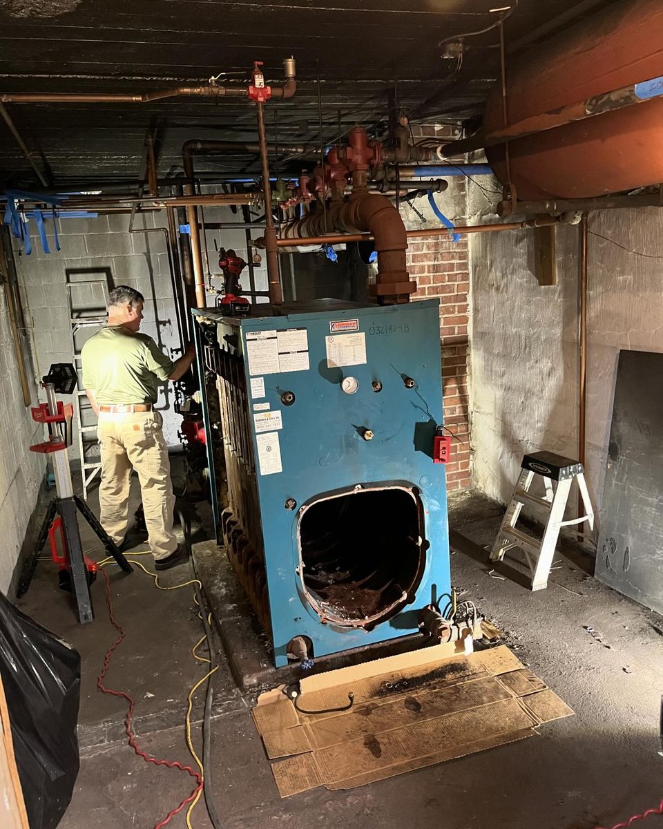 Experienced technician performing boiler installation for a trusted plumbing company in Chester County, PA