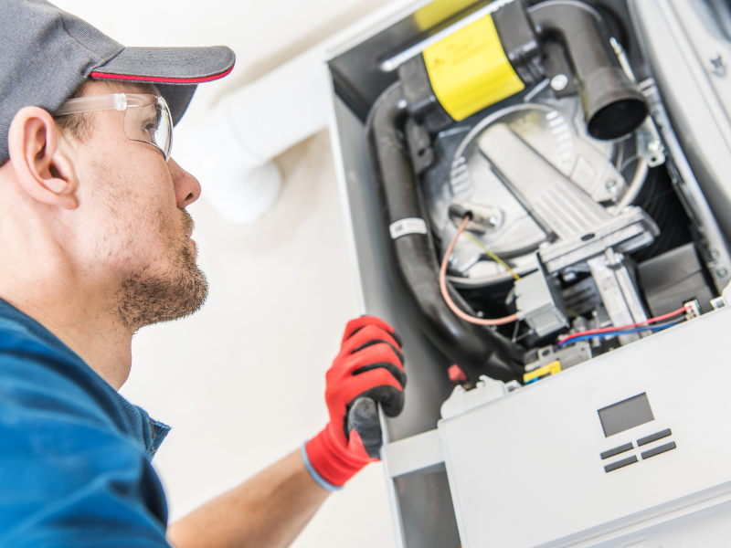 technician performing water heater repairs to ensure optimal performance and prevent future issues