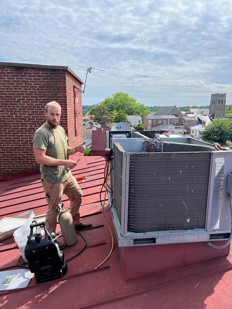 battavio plumbing heating and cooling technician performing hvac maintenance for reliable hvac and plumbing services in thorndale, pa