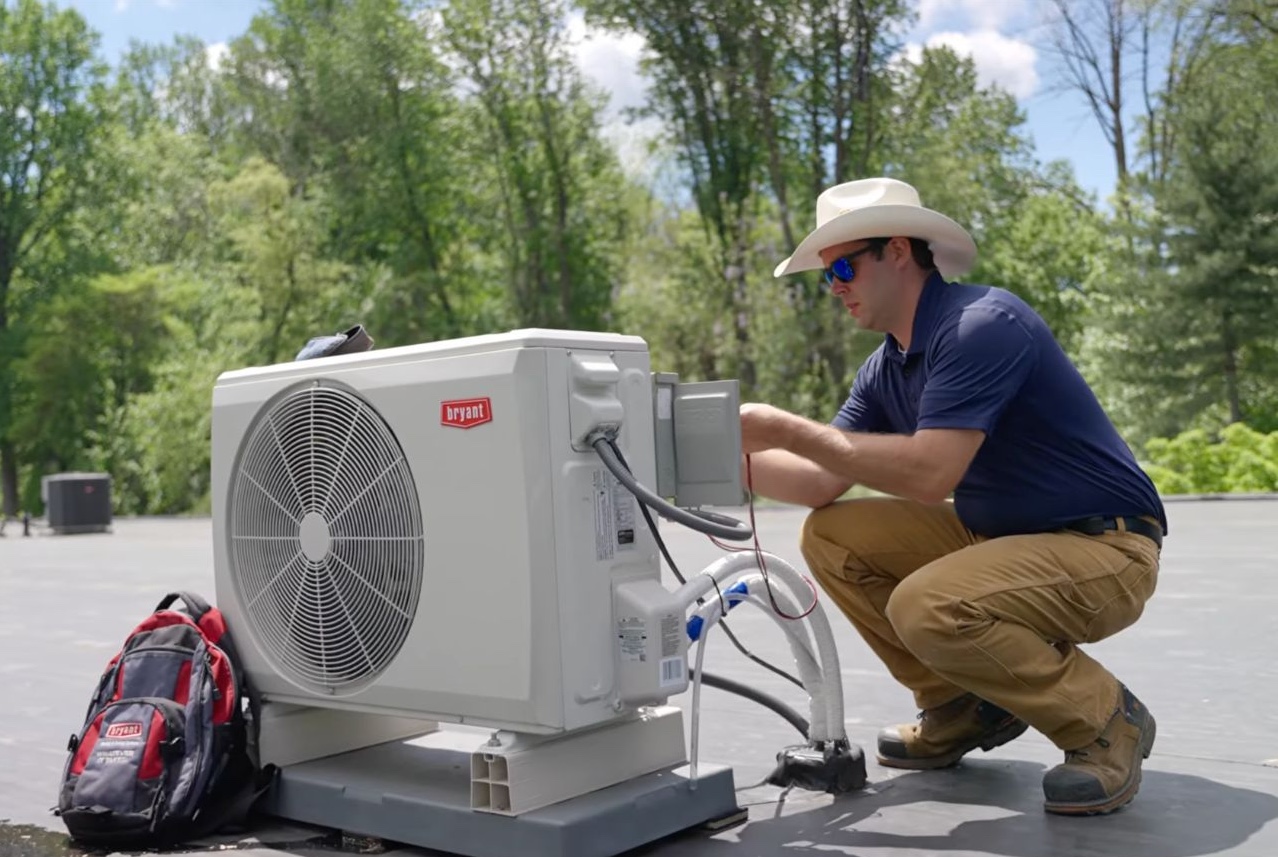 Technician servicing a rooftop HVAC unit in Chester County while helping property owners compare affordable HVAC prices for repairs and installations.